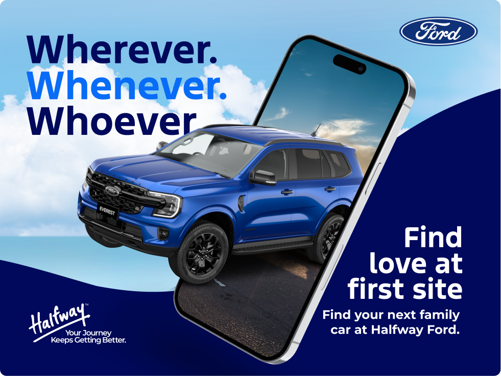 Blue Ford Everest SUV appearing to drive out of a smartphone screen with a sky and road background, text reading 'Wherever. Whenever. Whoever', and 'Find love at first site. Find your next family car at Halfway Ford.' Ford logo and Halfway branding included.