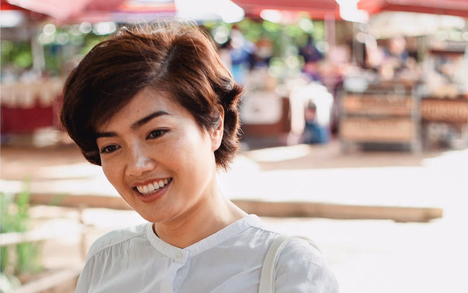 Smiling person against a light background