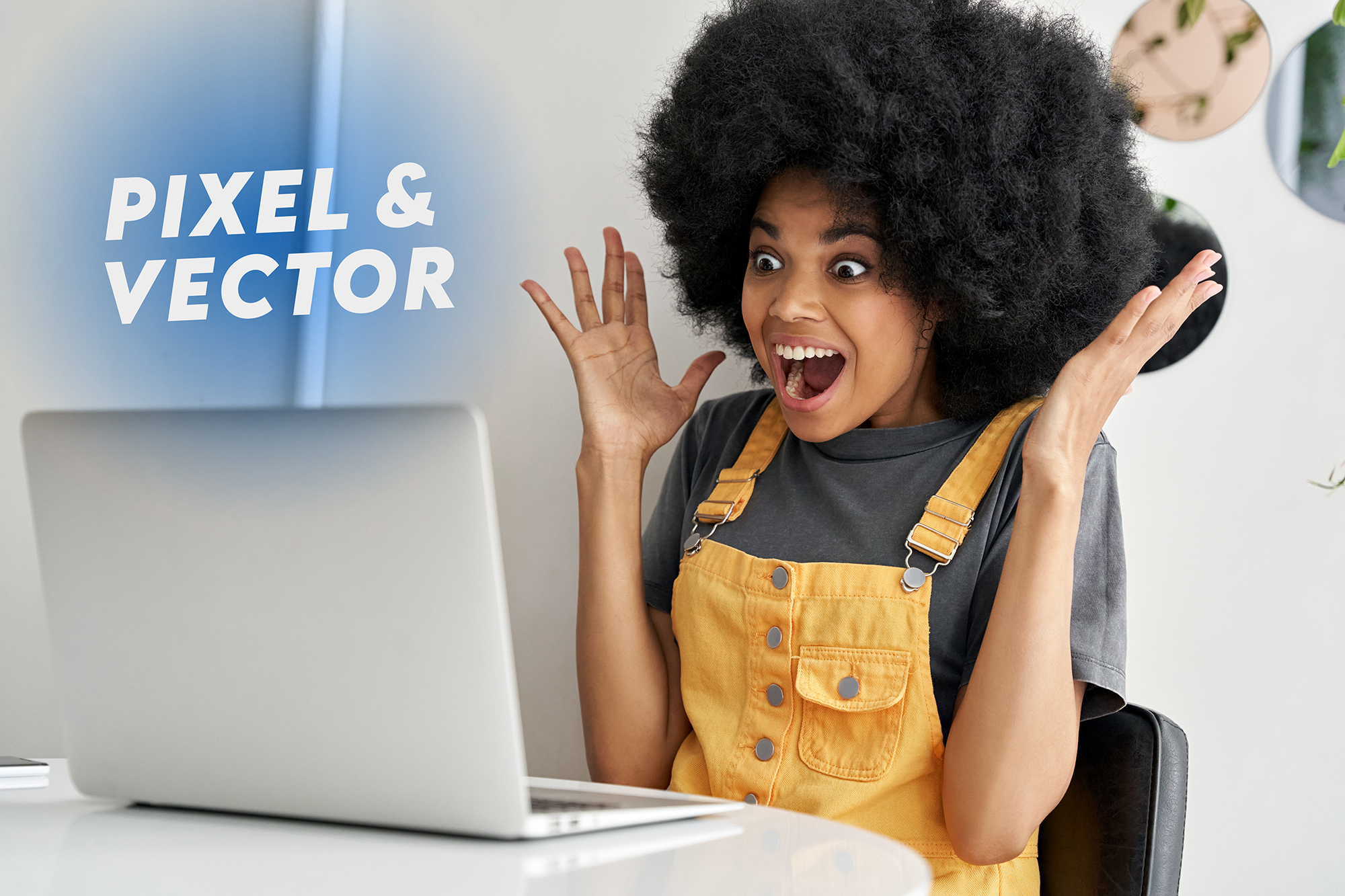 A very happy learner sitting in front of a laptop with her arms up
