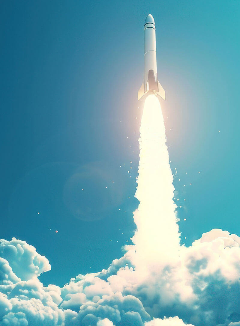A white rocket launching vertically into a bright blue sky with a massive trail of fire and smoke.
