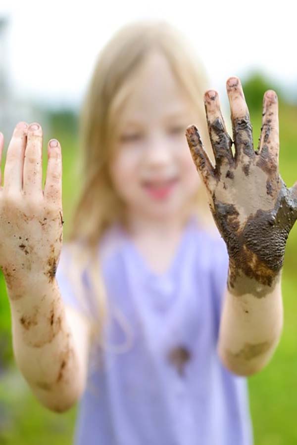 Girl playing with mud