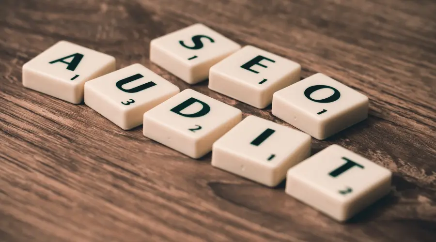 A photograph of Scrabble pieces spelling out 'SEO audit'