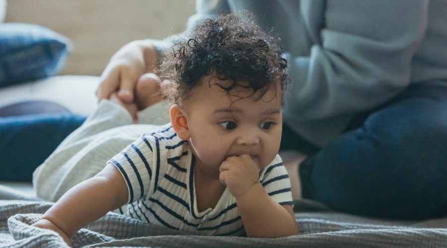 A young baby enjoying some tummy time