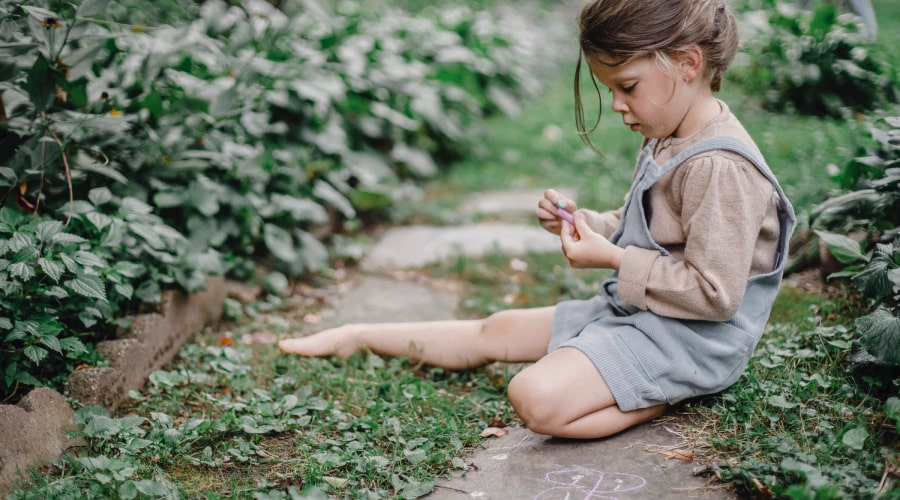 Girl playing barefoot in the garden