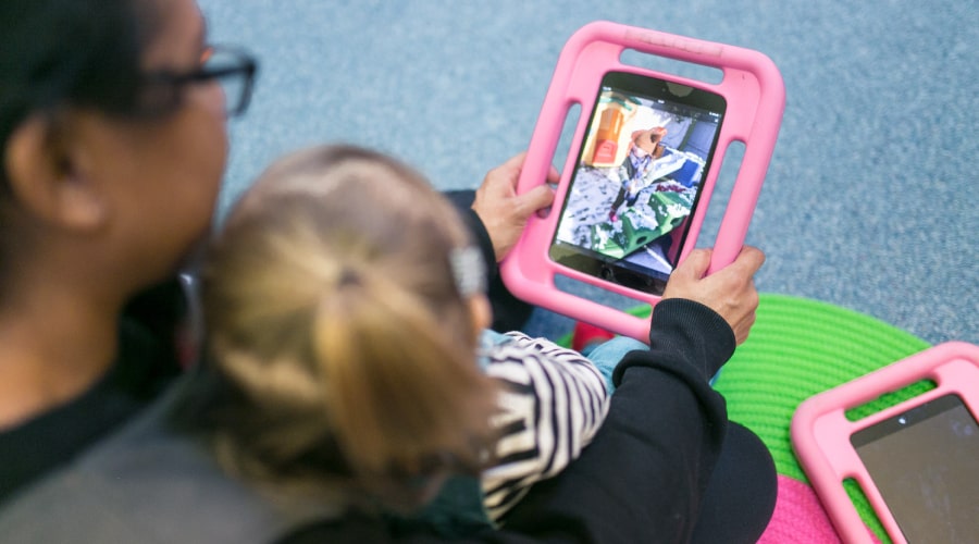 Adult holding a tablet