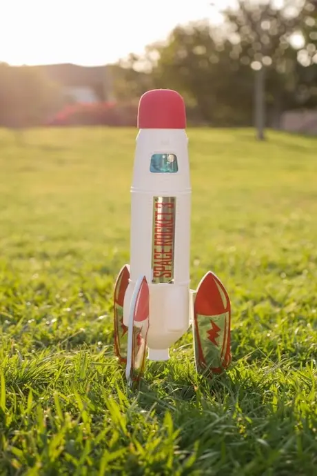 Plastic rocket on a grass field
