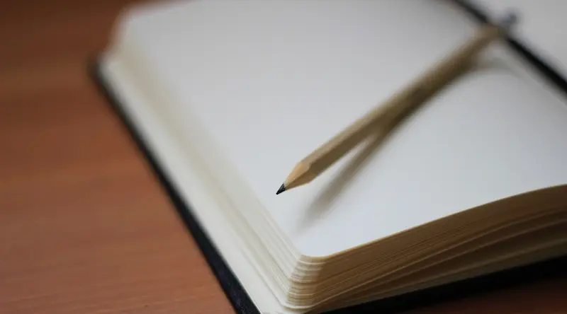 Pencil on open notebook