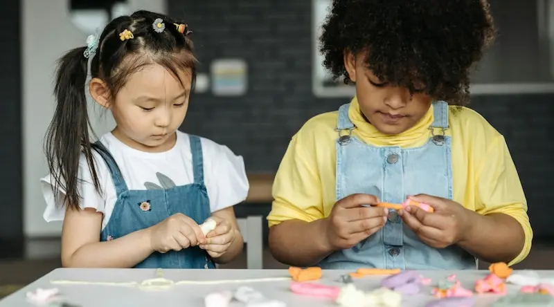 preschool students playing with play dough