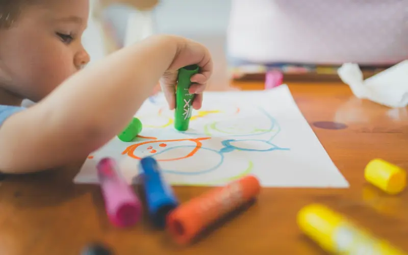 closeup of toddler coloring