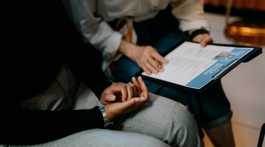 two adults looking at a digital resume