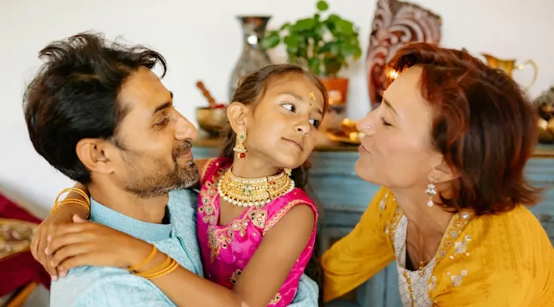 father, mother and daughter having a happy moment together