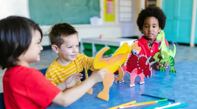 preschool boys playing with toys in the classroom