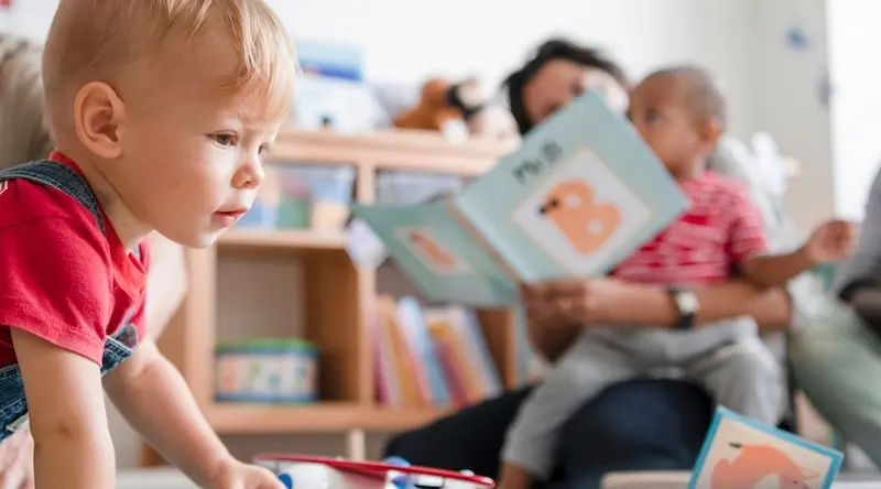young boy crawling at daycare