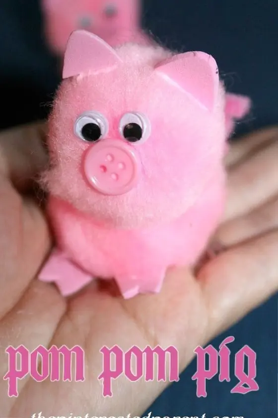 Pink pom pom piglet with googly eyes