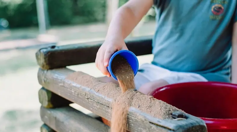 Boy playing with sand
