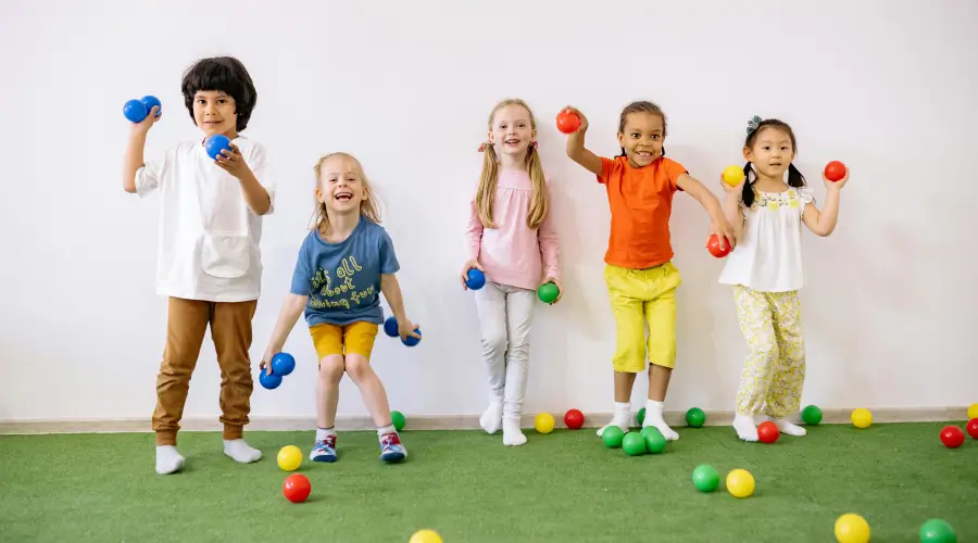 boys and girls throwing balls