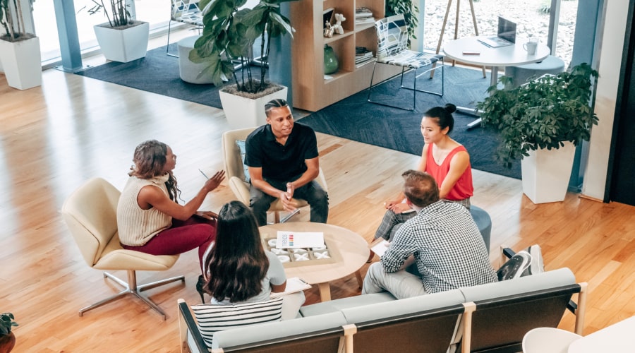 people sitting on chair in front of table having a meeting