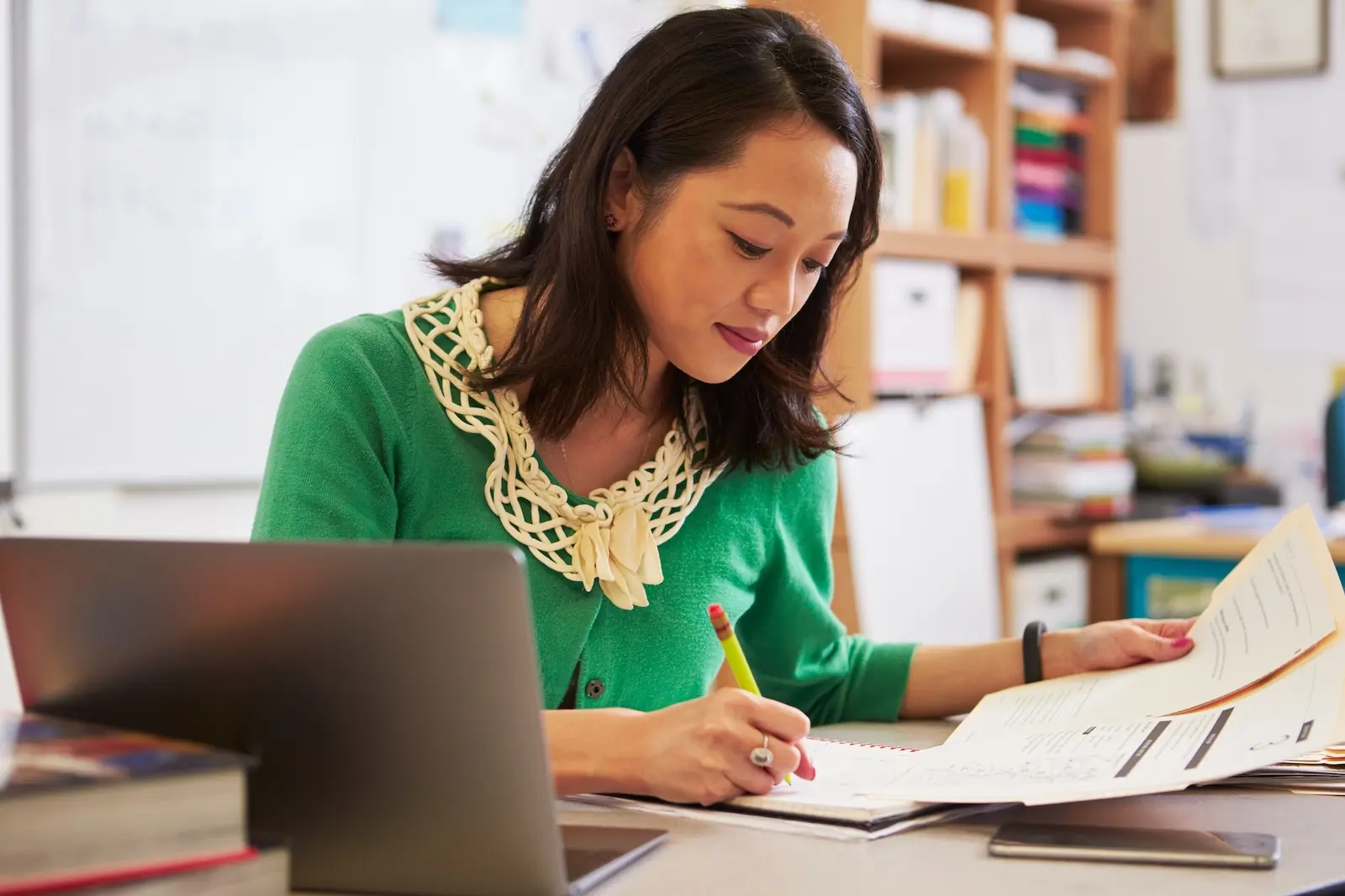 Preschool teacher doing paperwork