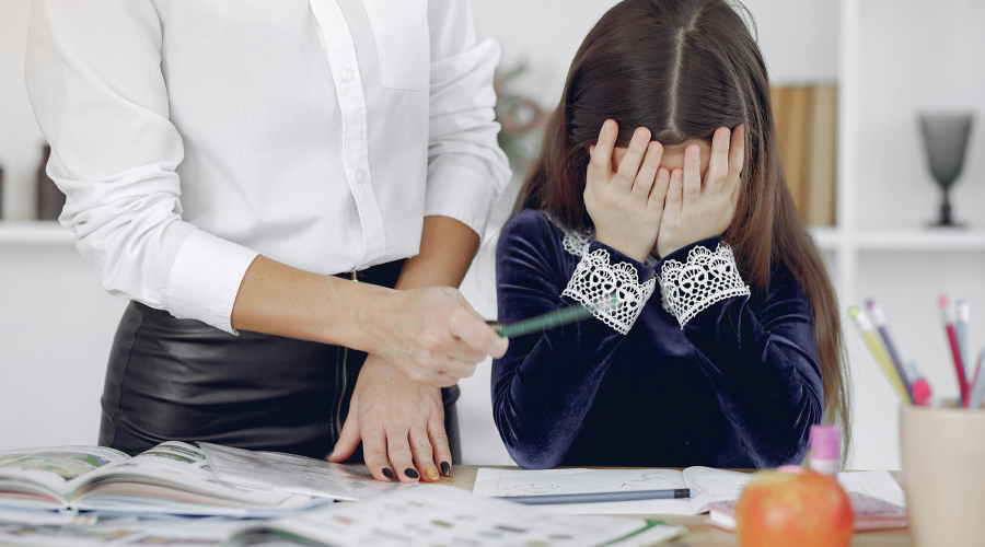 stressed child and teacher