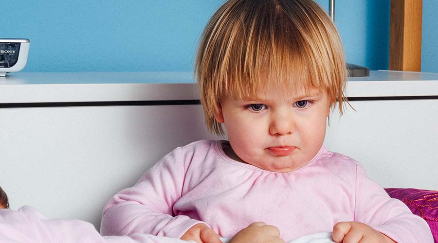 Girl tilting her head down communicating with body language her feelings