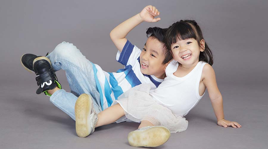 Children showing happiness with body language