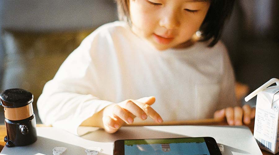 A child playing with an ipad