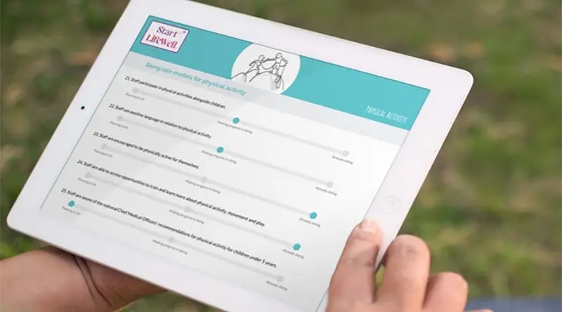 An iPad with an exercise programme on the screen