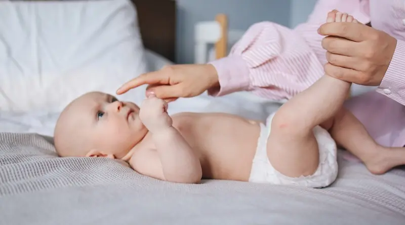 cute baby laying on a blanket