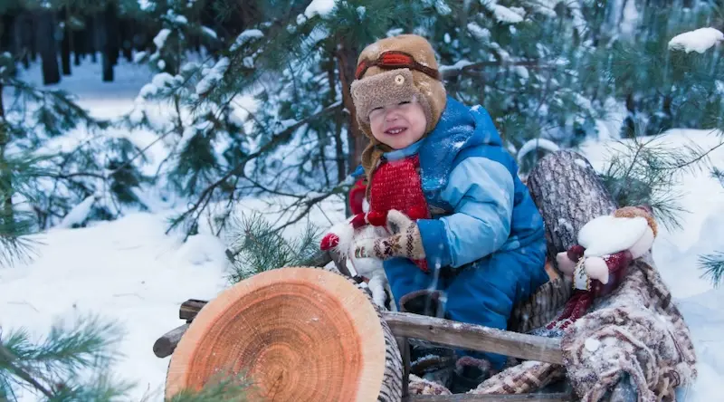 Kid playing in the snow