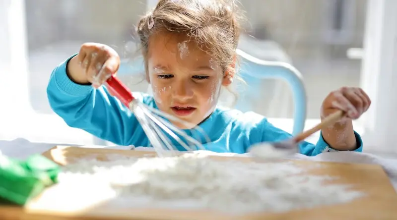 a girl baking and whisking