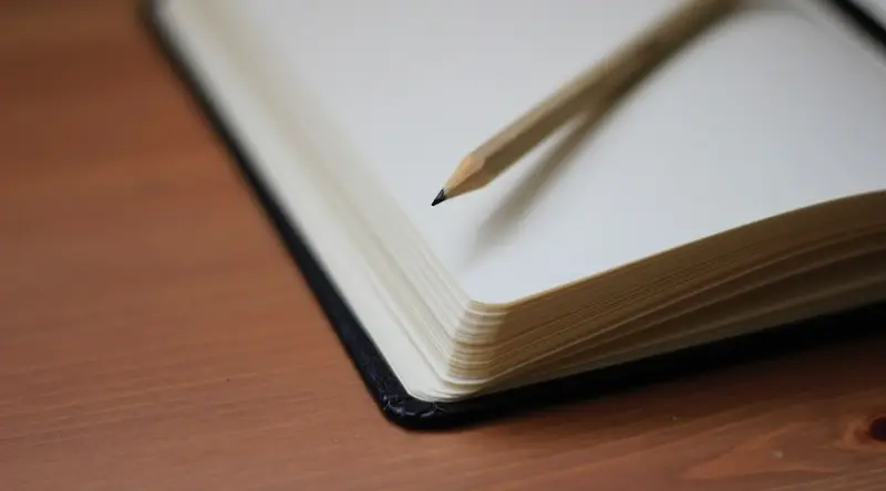 Close up of an eEmpty notebook and pencil