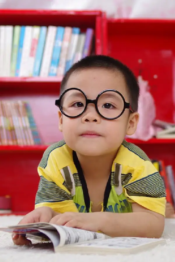 a boy reading a book