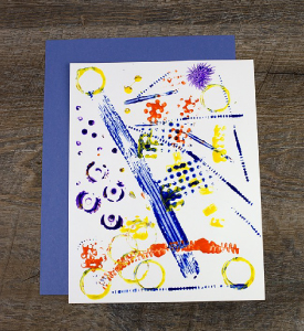 Piece of paper with colourful paint stains