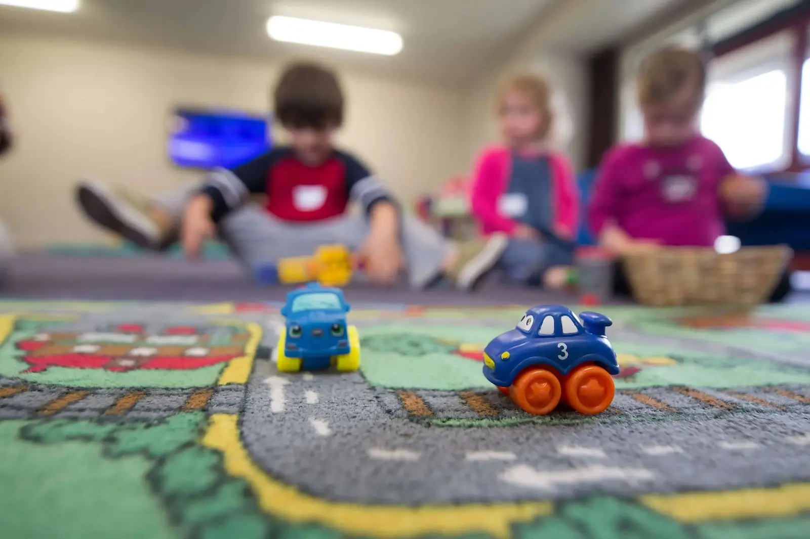 preschool children playing on carpet