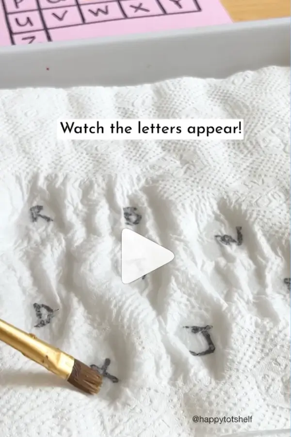 White paper with appearing letters after applying water