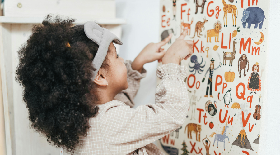 preschool girl learning her alphabet