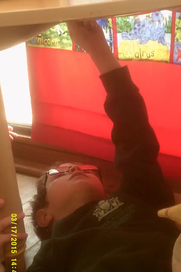 boy playing upside down