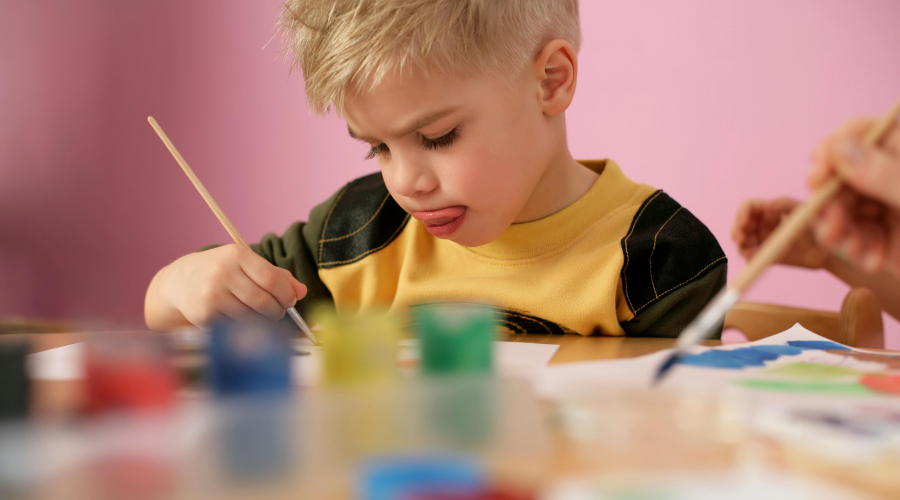 preschool boy painting
