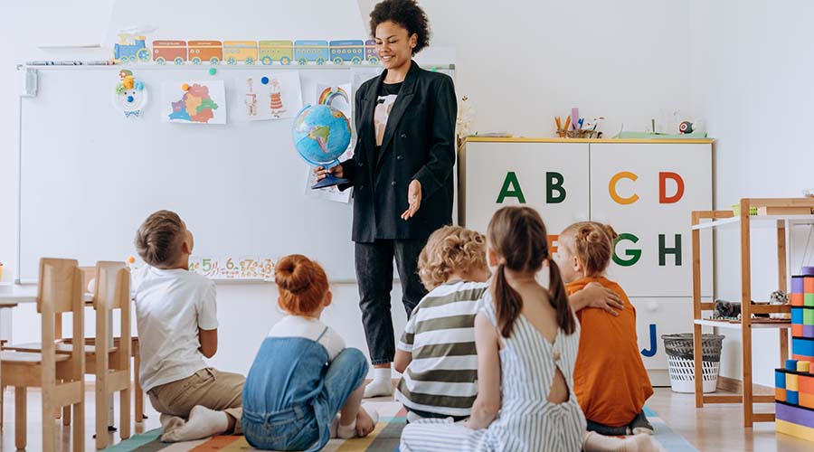 Early educator talking to children about the news