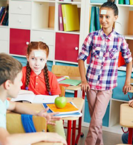 Kids playing Guess Who I Am.