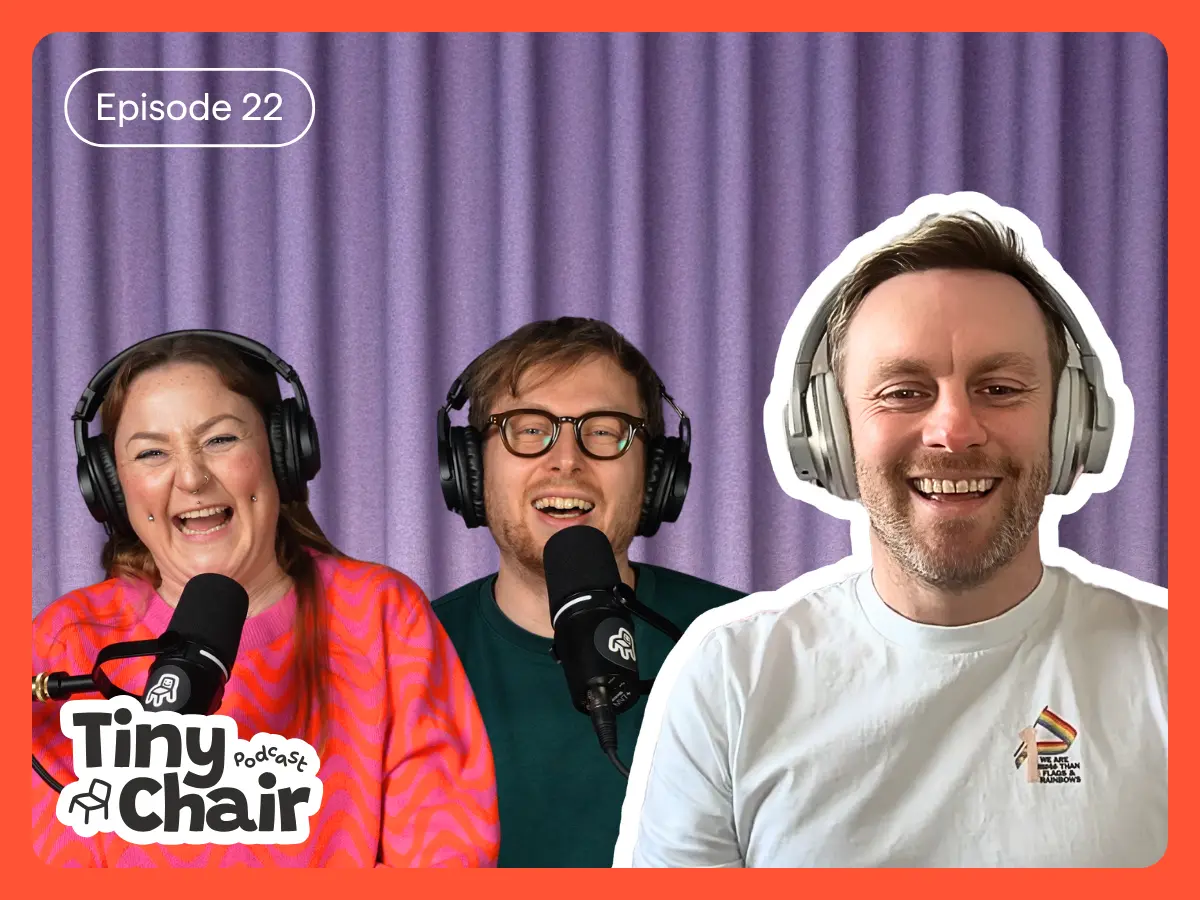 Tiny Chair Podcast hosts Julia and Matt with guest, Ian Timbrell, with a purple curtain as a background