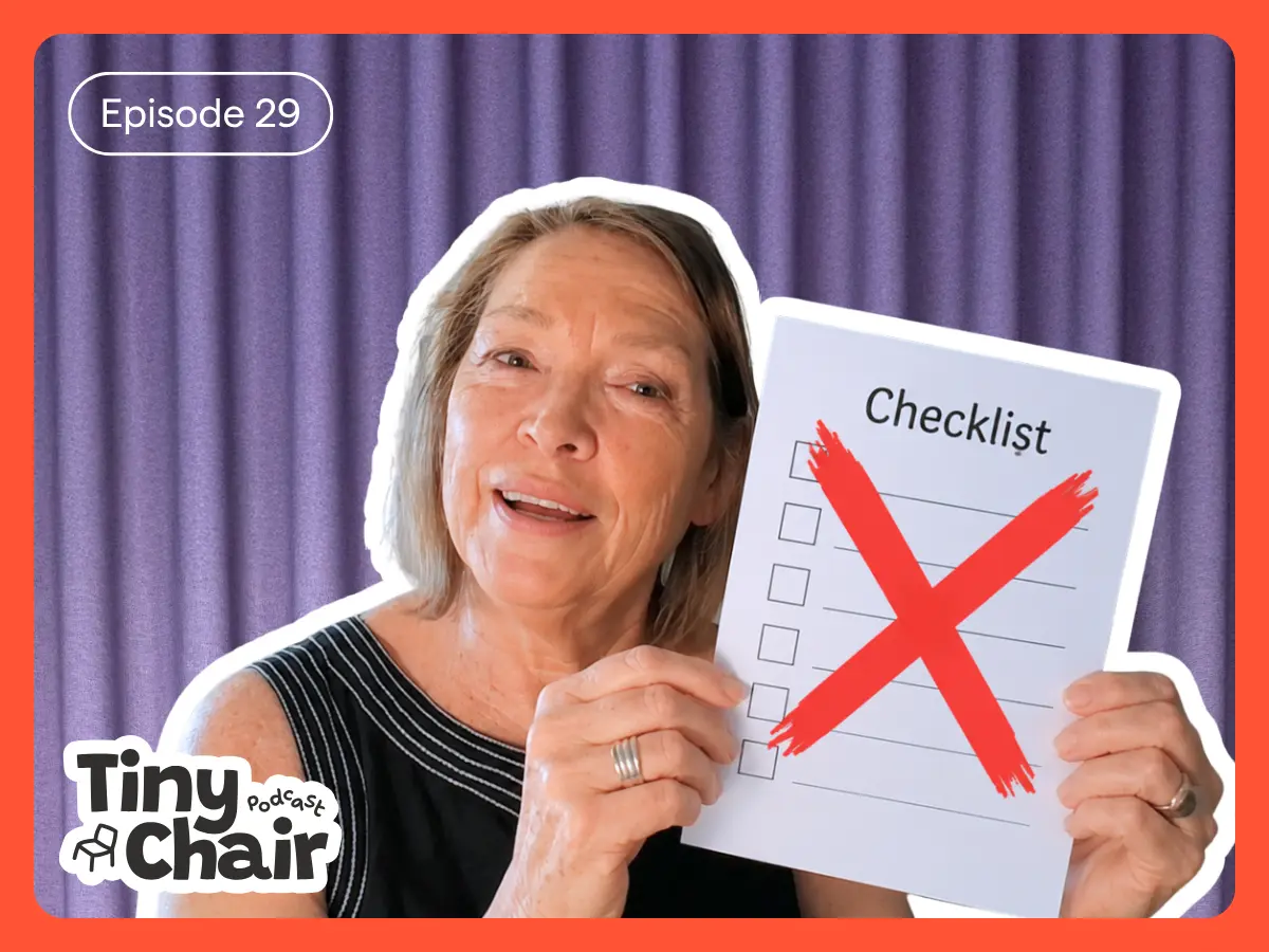 Lady on a purple curtain background holds a piece of paper reading "Checklist" with a solid red crossed lines