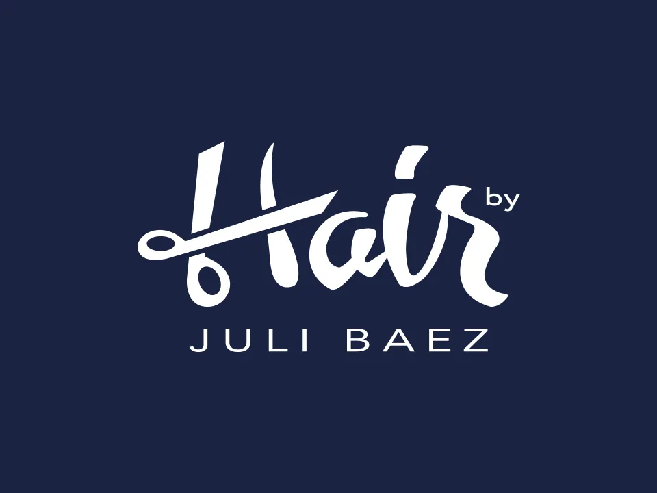Logo with the word Hair featuring scissors and 'by Juli Baez' below on a dark background.