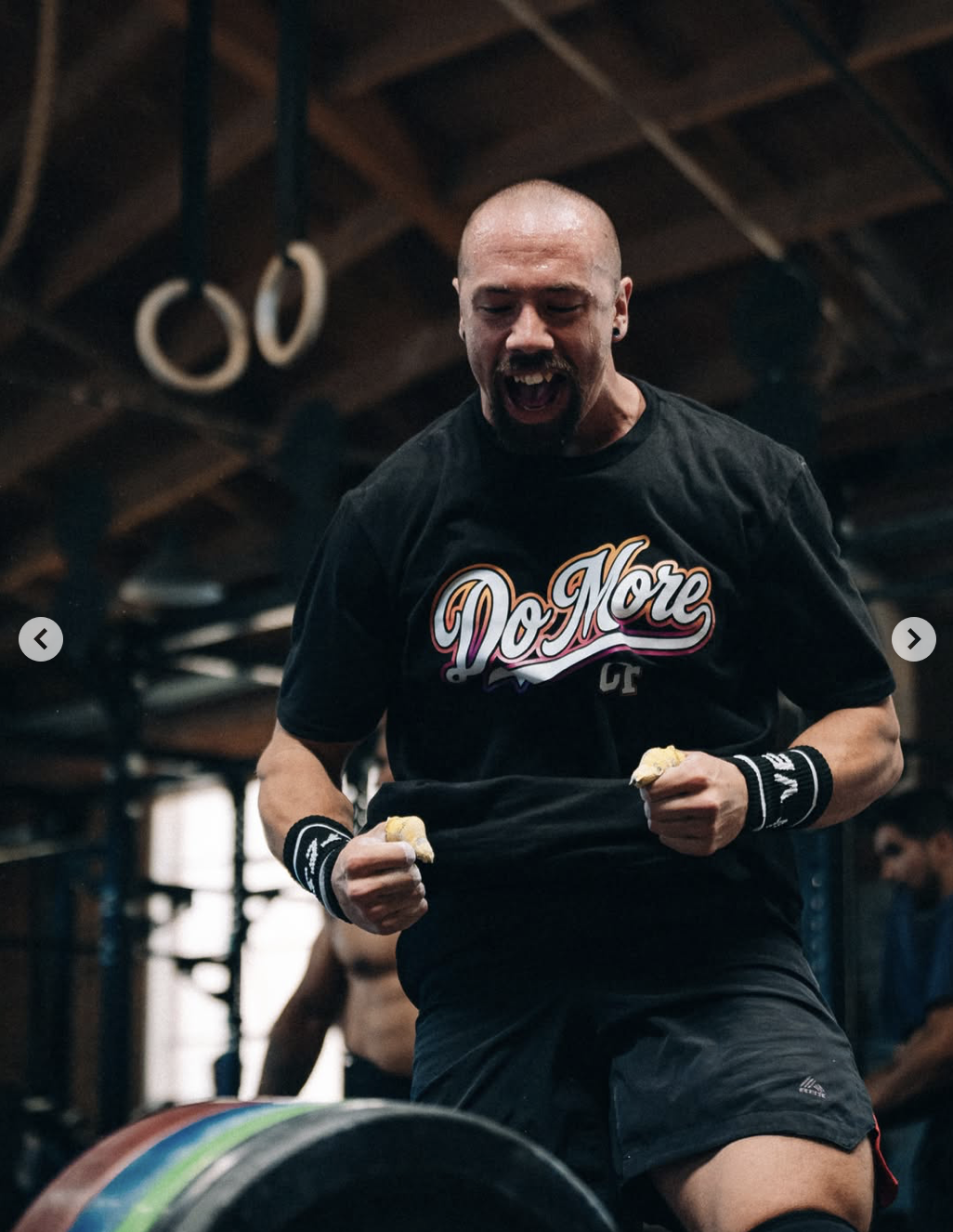 male athlete from do more corssfit in los angeles doing a bar muscle up while competing at west la athletics