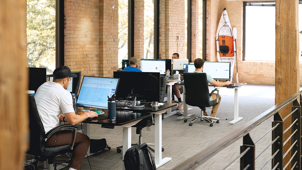people working at a desk