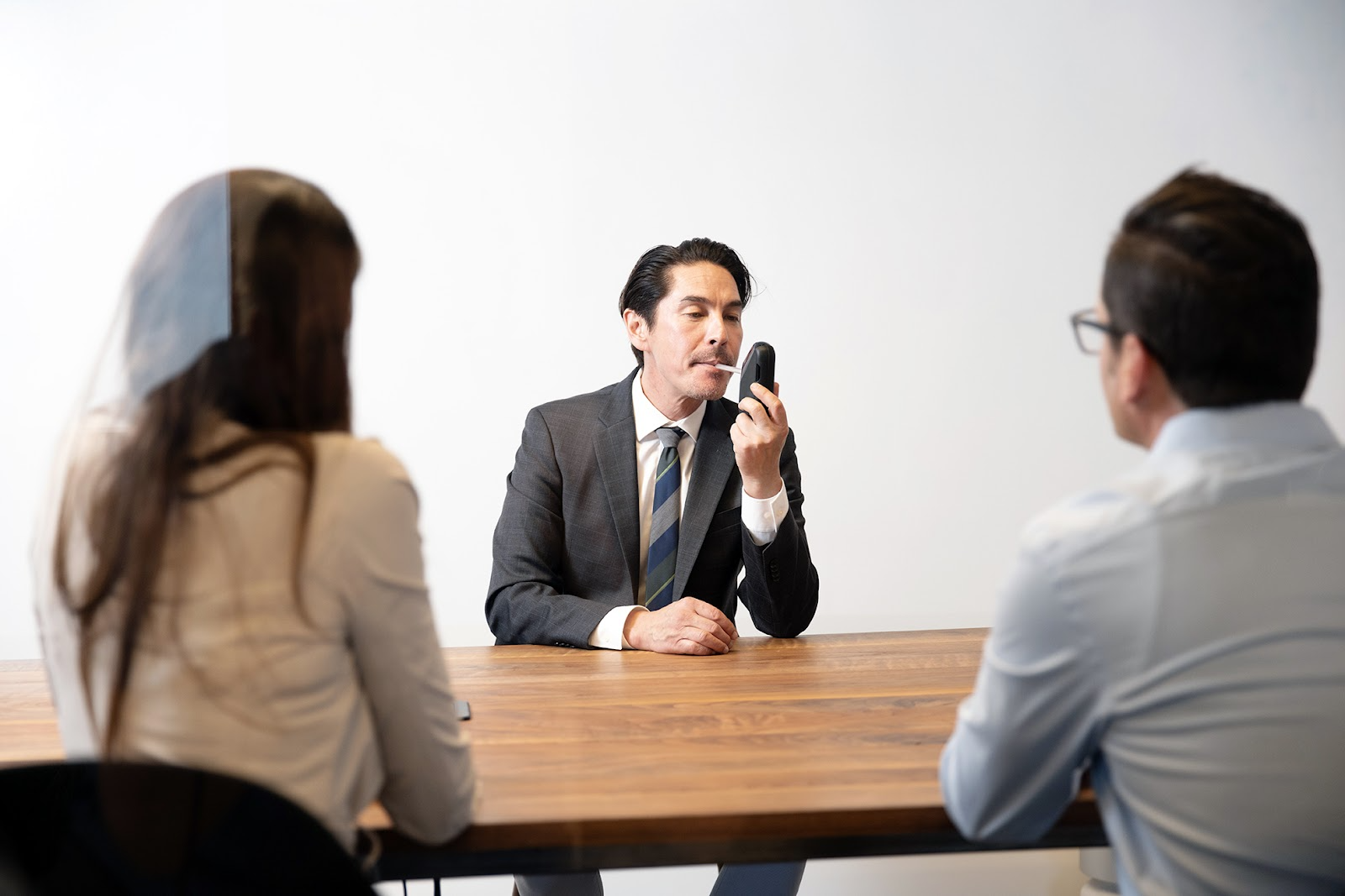 A lawyer demonstrating the Soberlink device