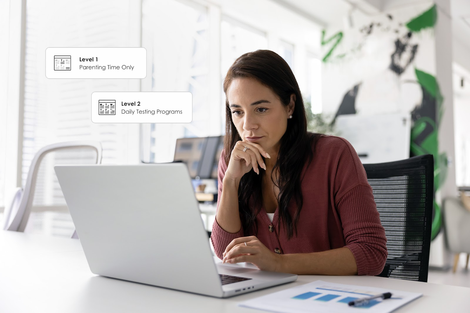 A woman looking at her laptop