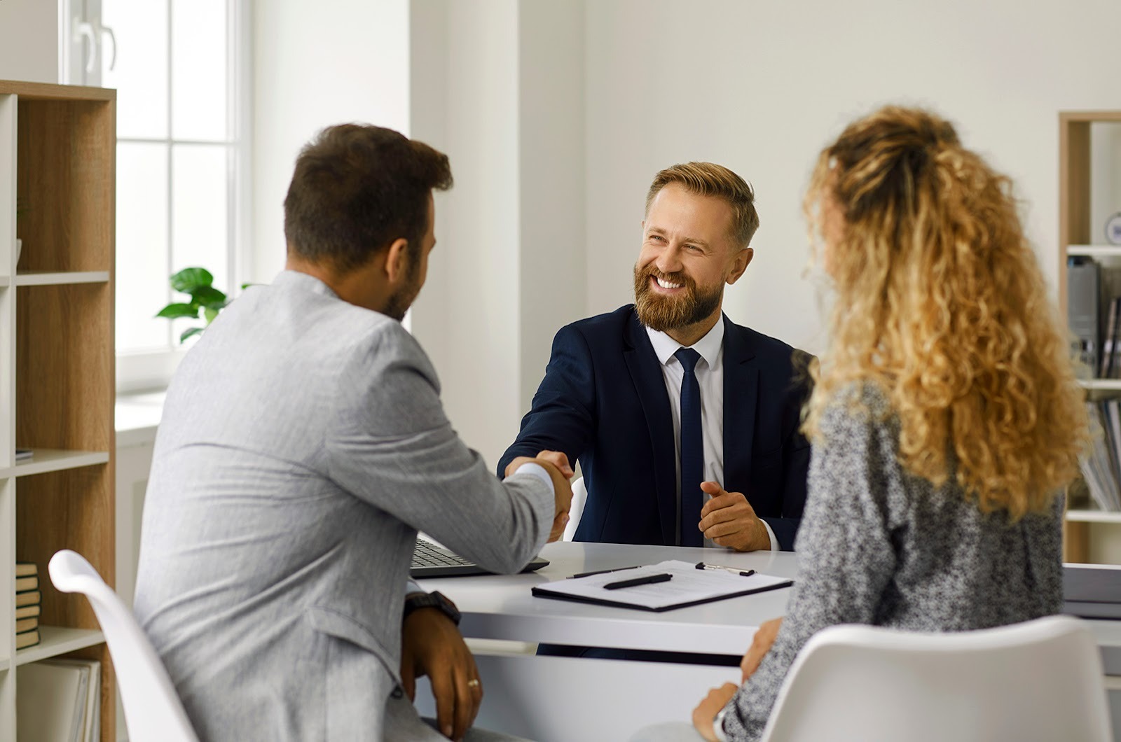 A lawyer meeting with his clients.
