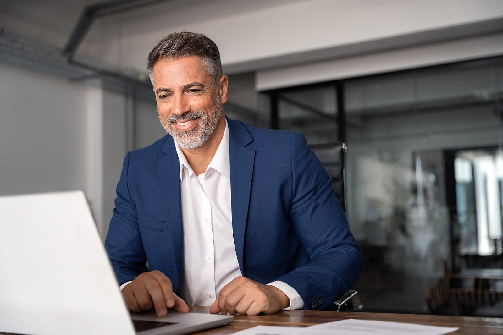 A man looking at his laptop.
