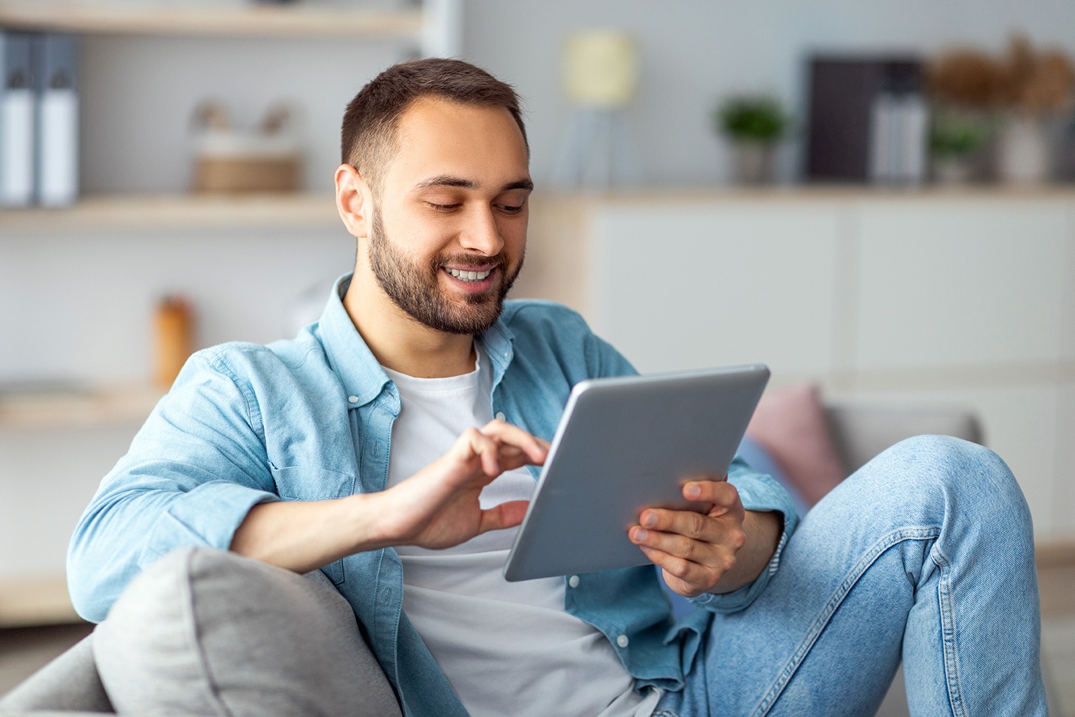 A man using his tablet.
